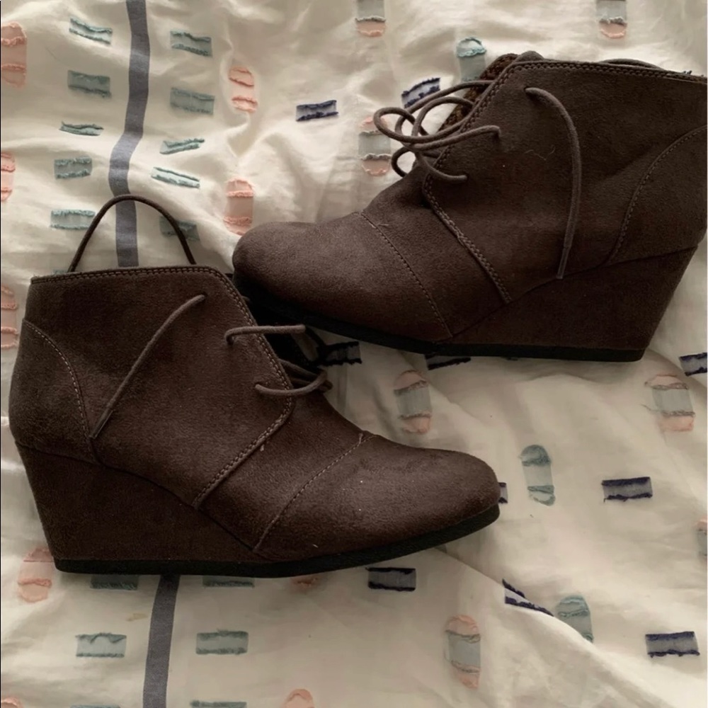 Woman’s suede wedge booties